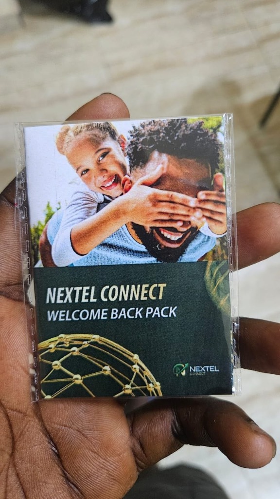 Hand holding Nextel Connect Welcome Back Pack package